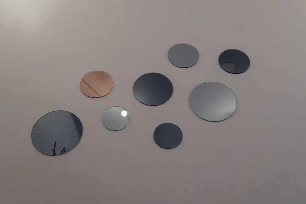 Aesthetic wall decoration featuring various round mirrors for modern interior design.